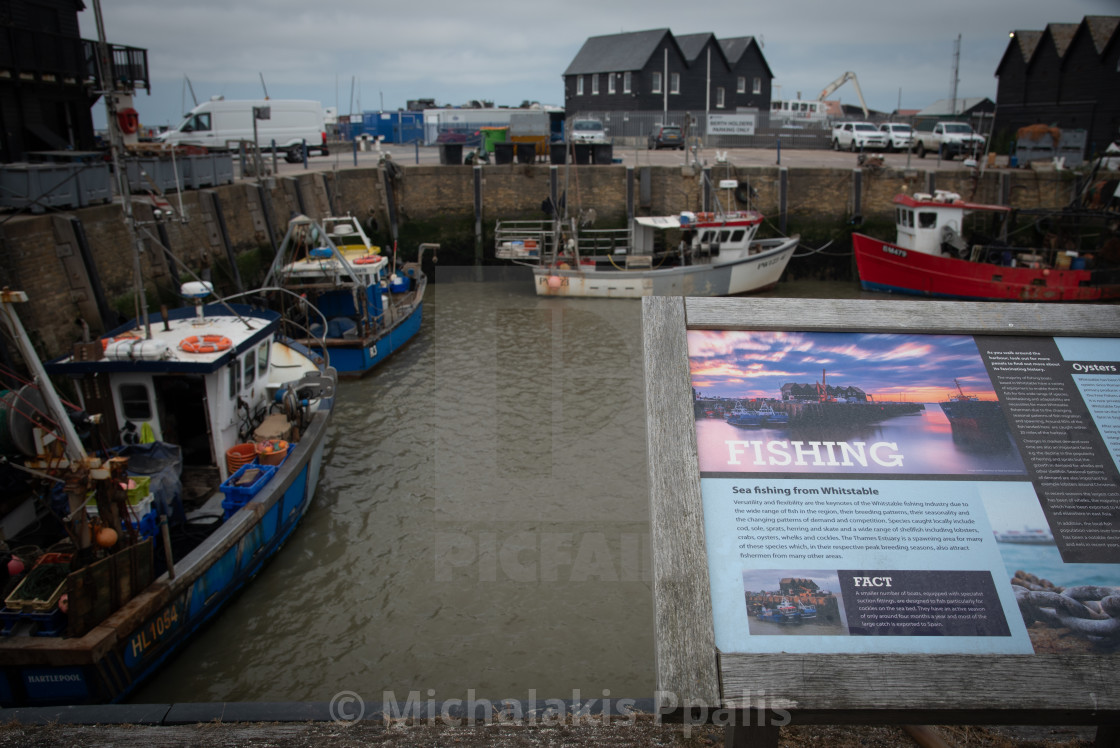 "Fishing boats moored at Whitstable harbor in Kent England" stock image