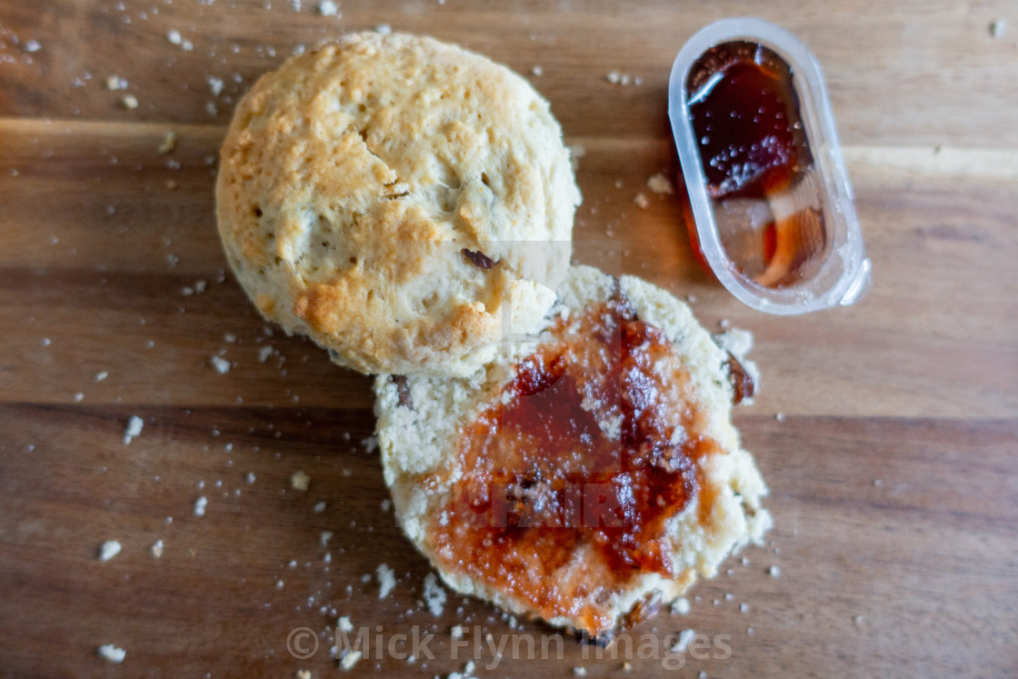 "Scone with jam first then clotted cream" stock image