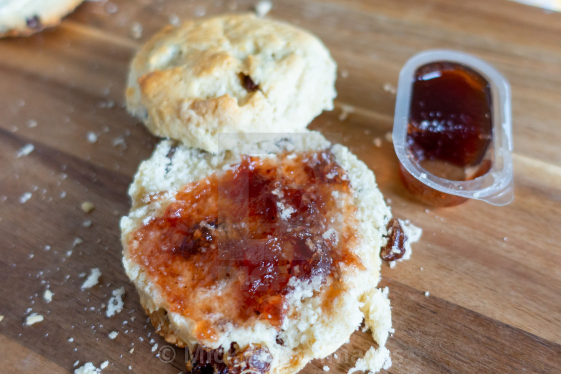 "Scone with jam first then clotted cream" stock image