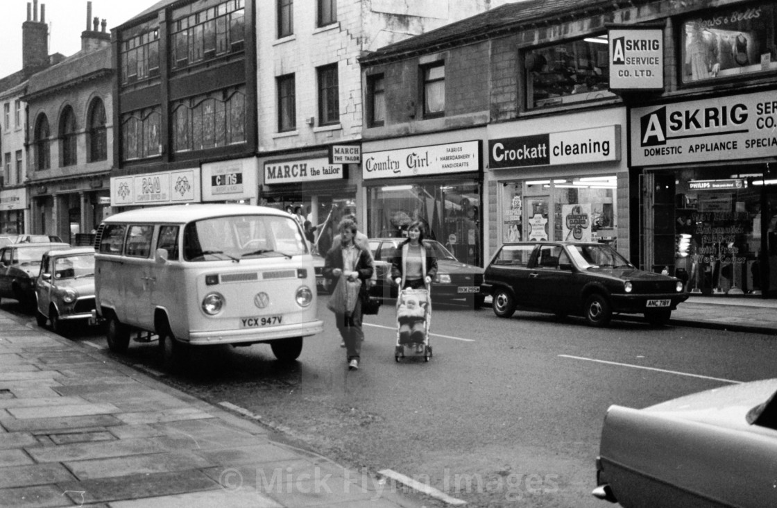 "North Parade, Bradford, West Yorkshire, UK. Local shops and two women with..." stock image