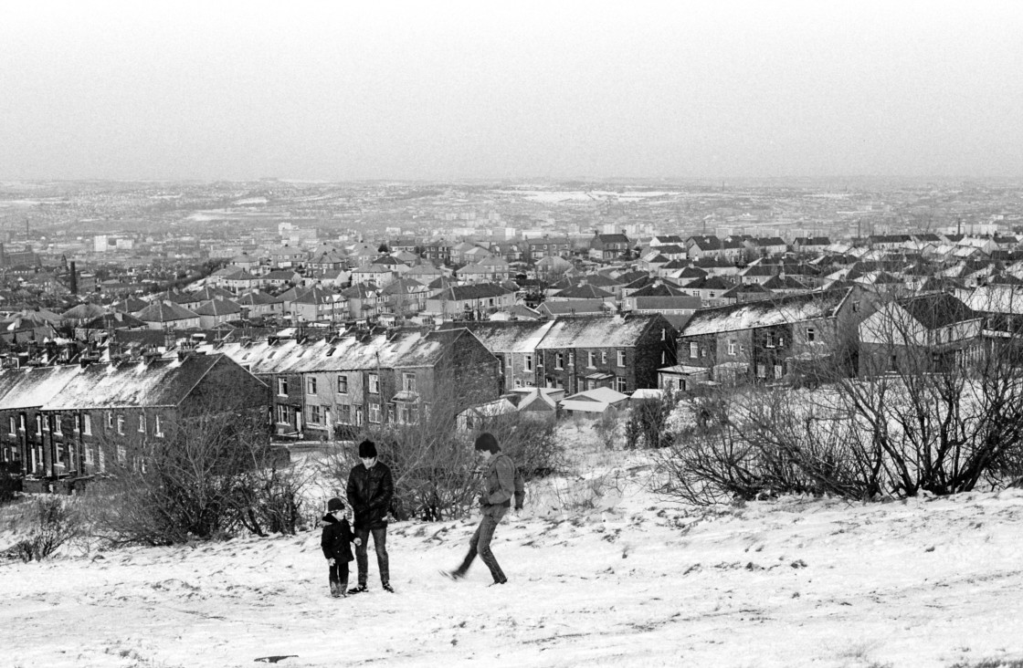 "Beldon Hill, Bradford, West Yorkshire, UK. Two men and a young boy playing in..." stock image