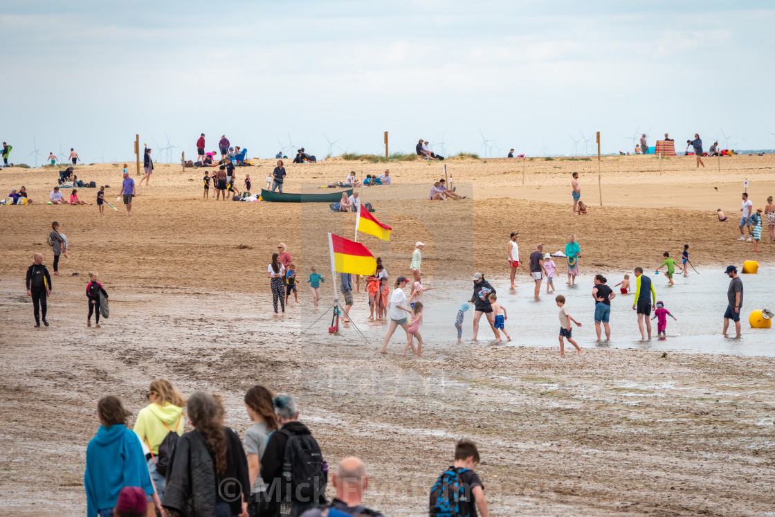 "Wells-next-the-sea North Norfolk, UK, a Muslim staycationer family walk on..." stock image