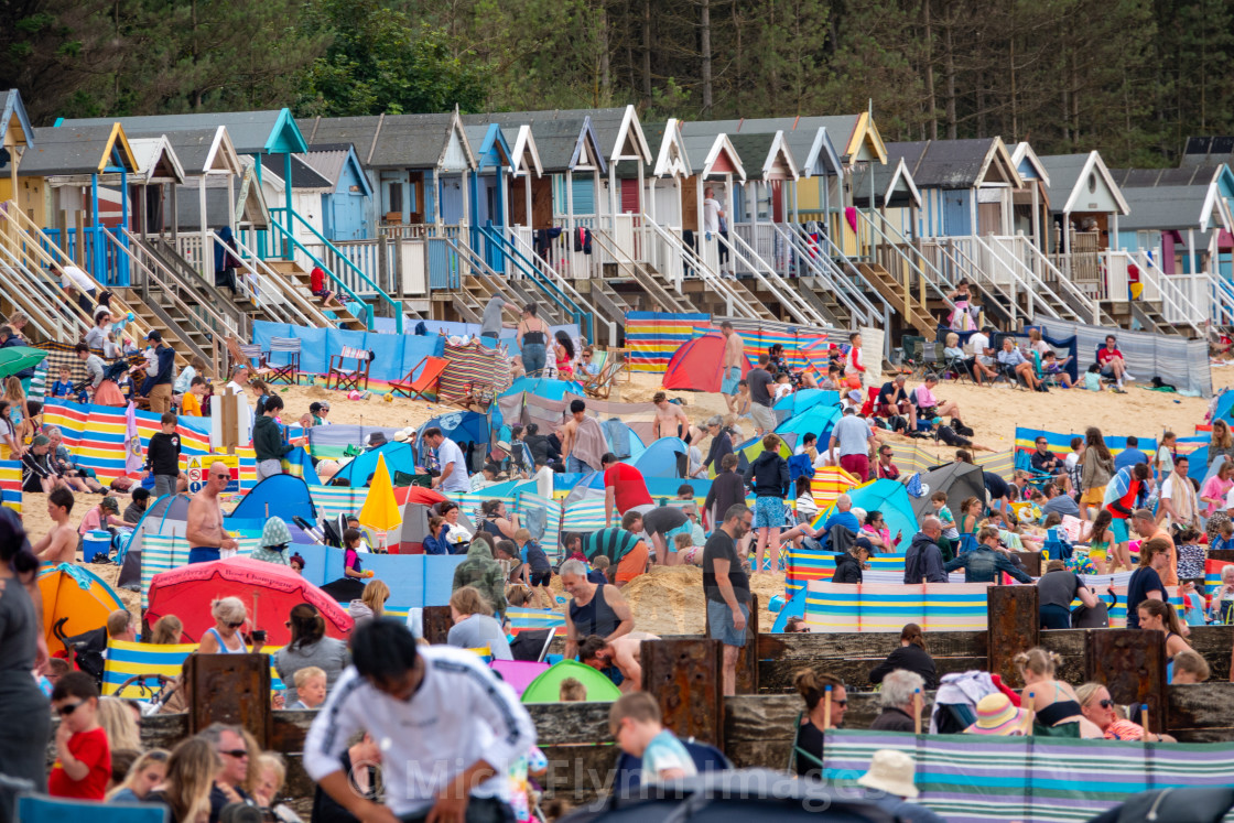 "Wells-next-the-sea North Norfolk, UK, families on the crowded beach with..." stock image