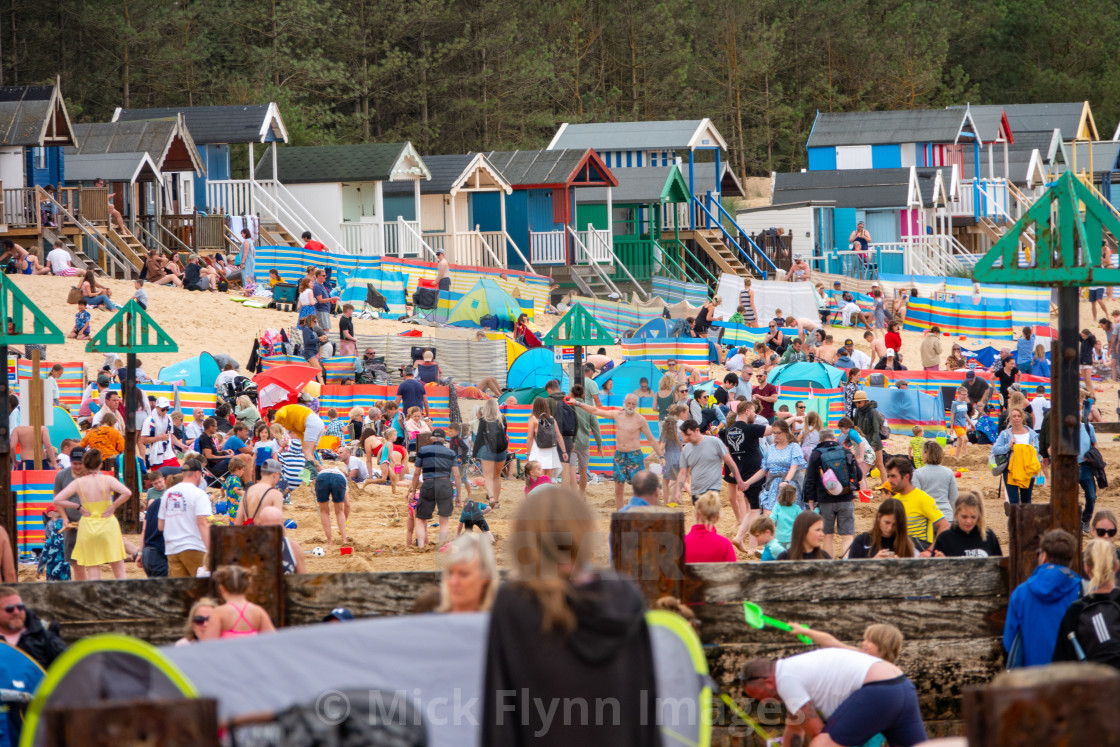 "Wells-next-the-sea North Norfolk, UK, families on the crowded beach with..." stock image