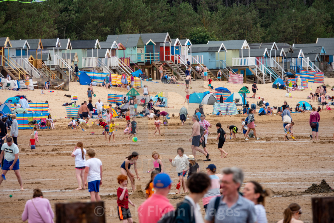 "Wells-next-the-sea North Norfolk, UK, families on the crowded beach with..." stock image