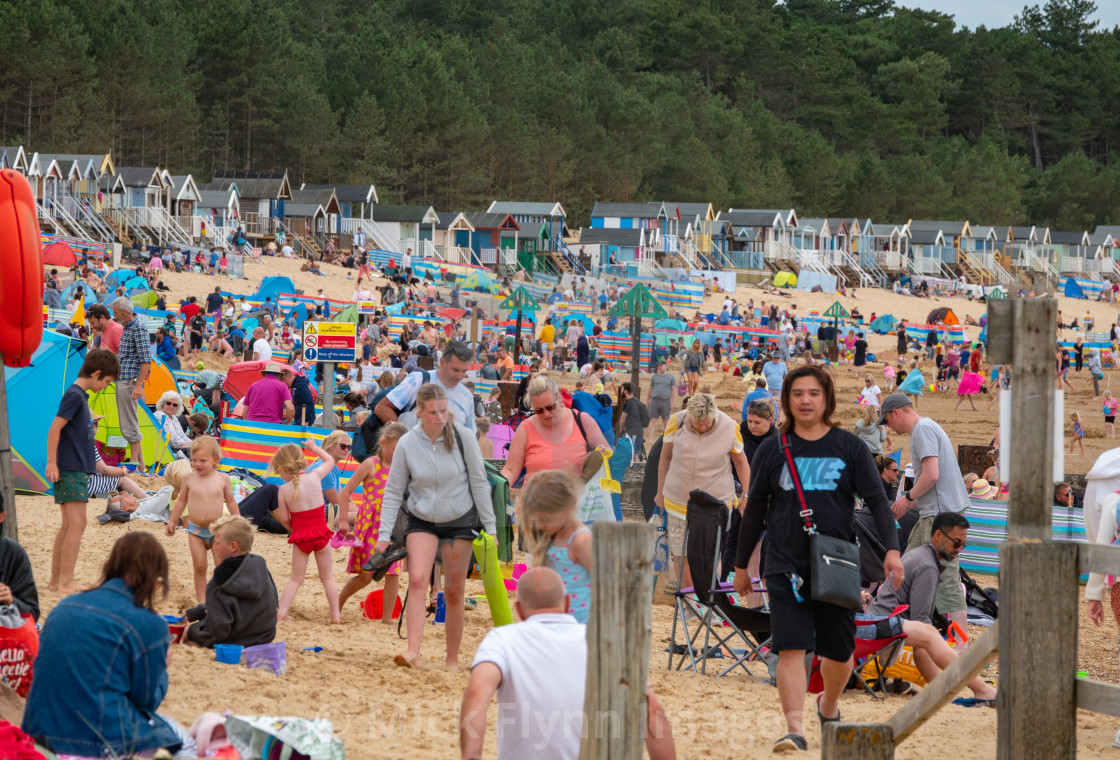 "Wells-next-the-sea North Norfolk, UK, families on the crowded beach with..." stock image