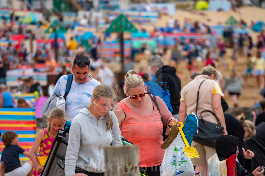 "Wells-next-the-sea North Norfolk, UK, a family walk through the crowds on..." stock image