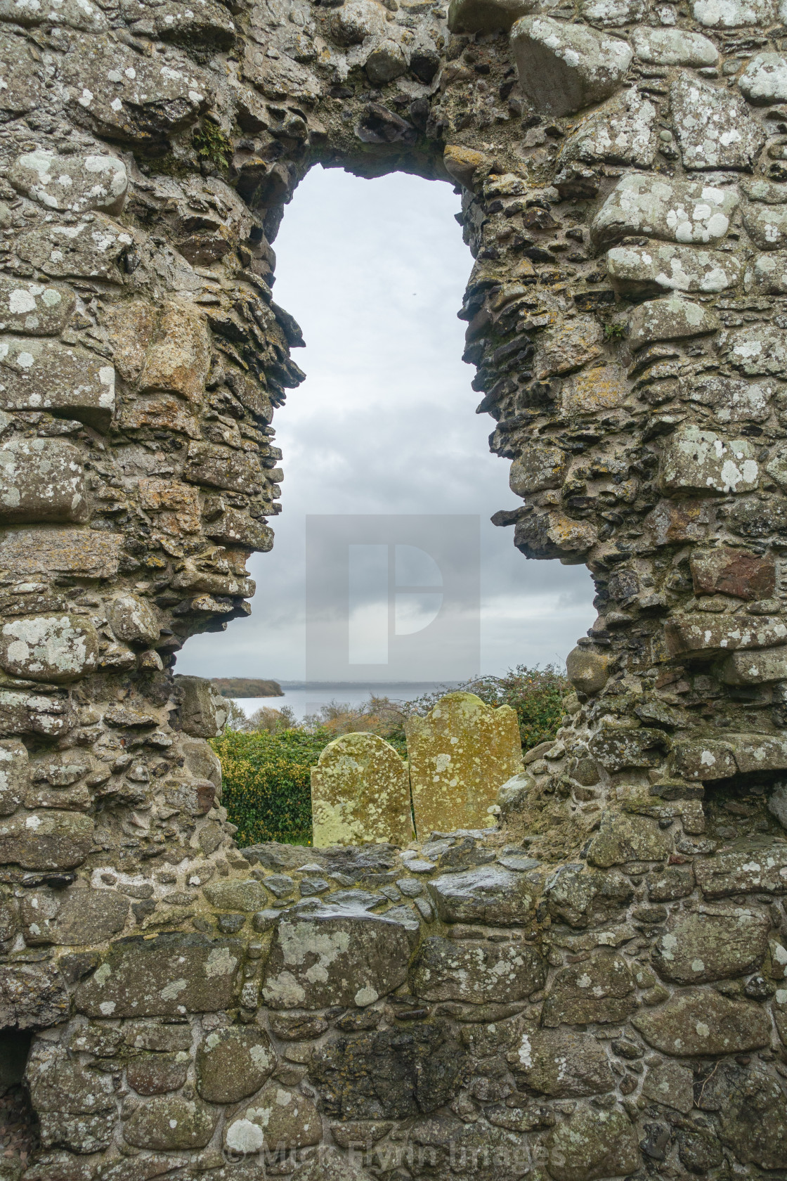 "The ruins of a 13th century Church at Cranfield and St Olcan's Shrine on the..." stock image