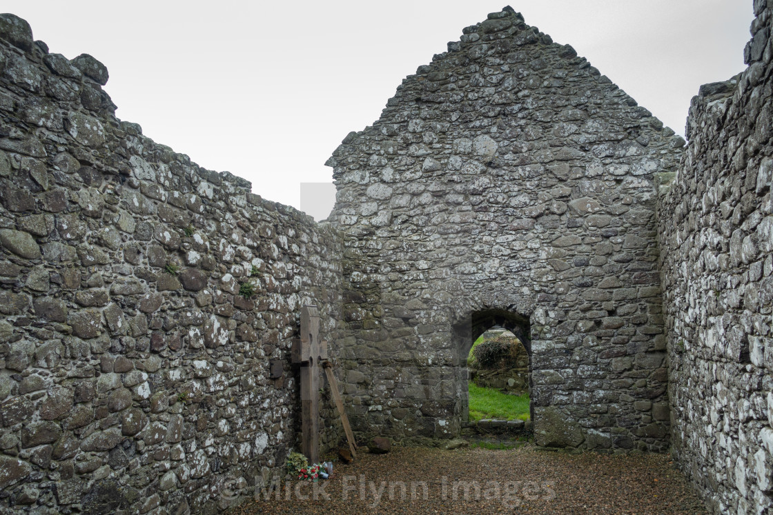 "The ruins of a 13th century Church at Cranfield and St Olcan's Shrine on the..." stock image