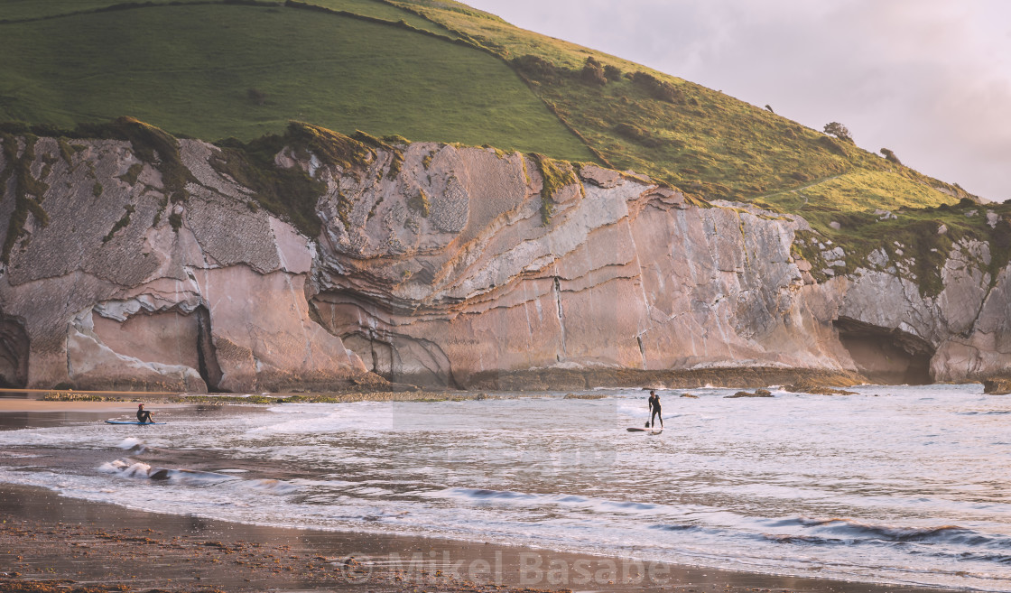 "Doing paddle surf in Itzurun beach in Zumaia, Basque Country" stock image