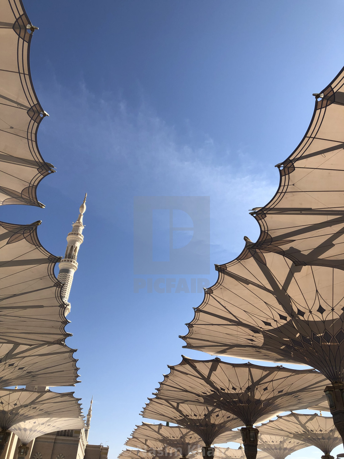 "Huge Folding Umbrellas in Madinah" by Nasim Khan - £24.80 "Huge Folding Umbrellas in Madinah" stock image