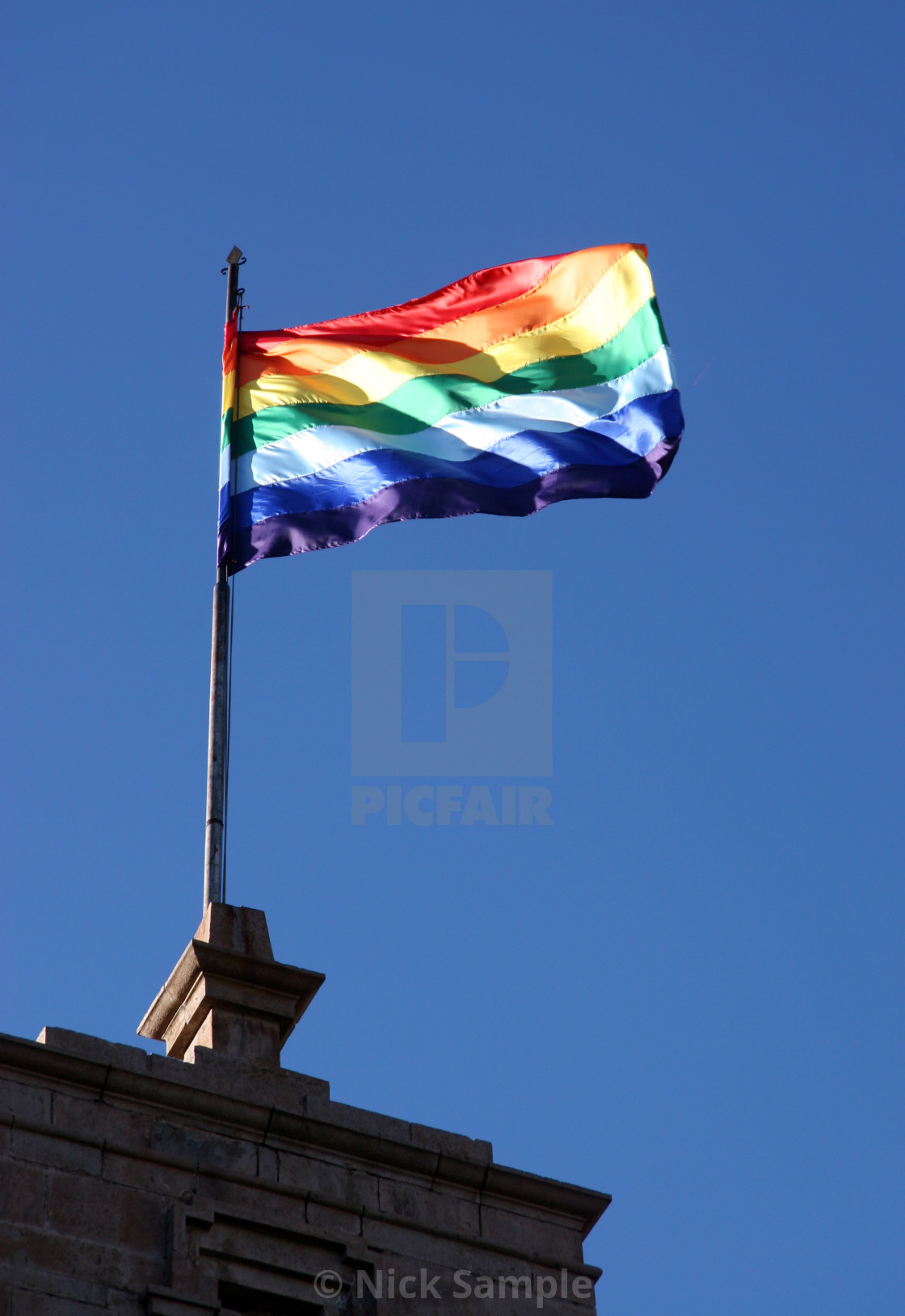 "Rainbow in a clear blue sky" stock image