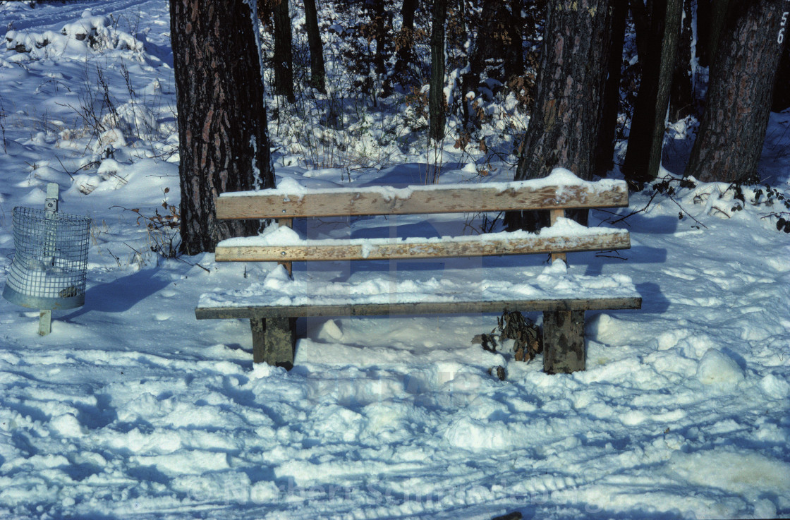 "Bench covered with snow" stock image