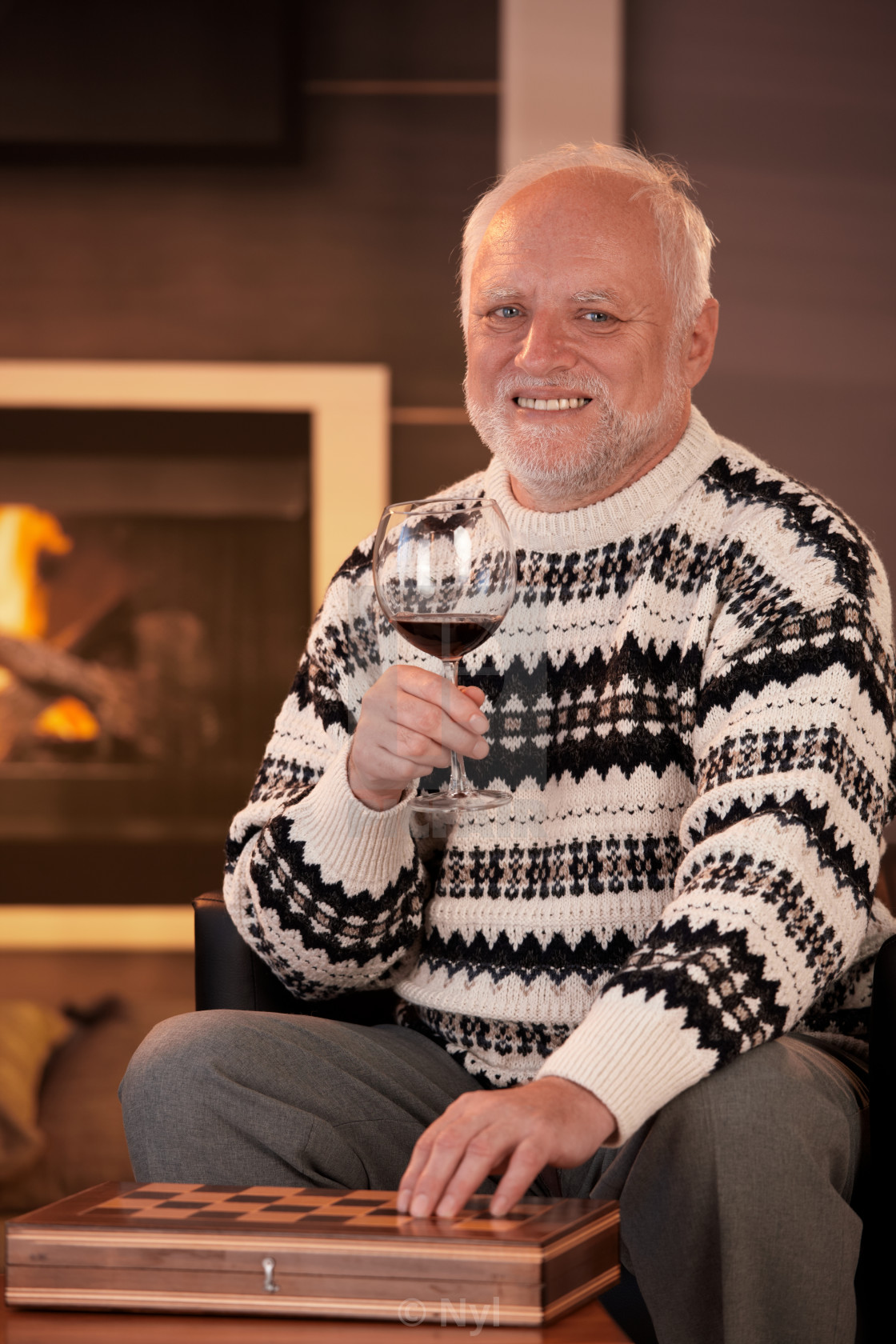 "Portrait of happy senior man having wine" stock image