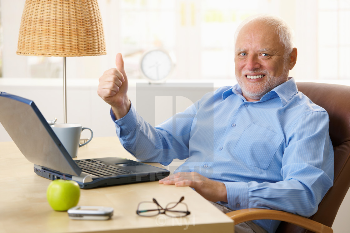 "Happy senior man giving thumb up" stock image