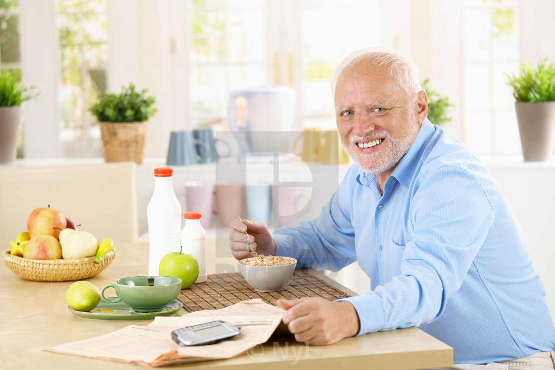 "Cheerful senior man having breakfast" stock image