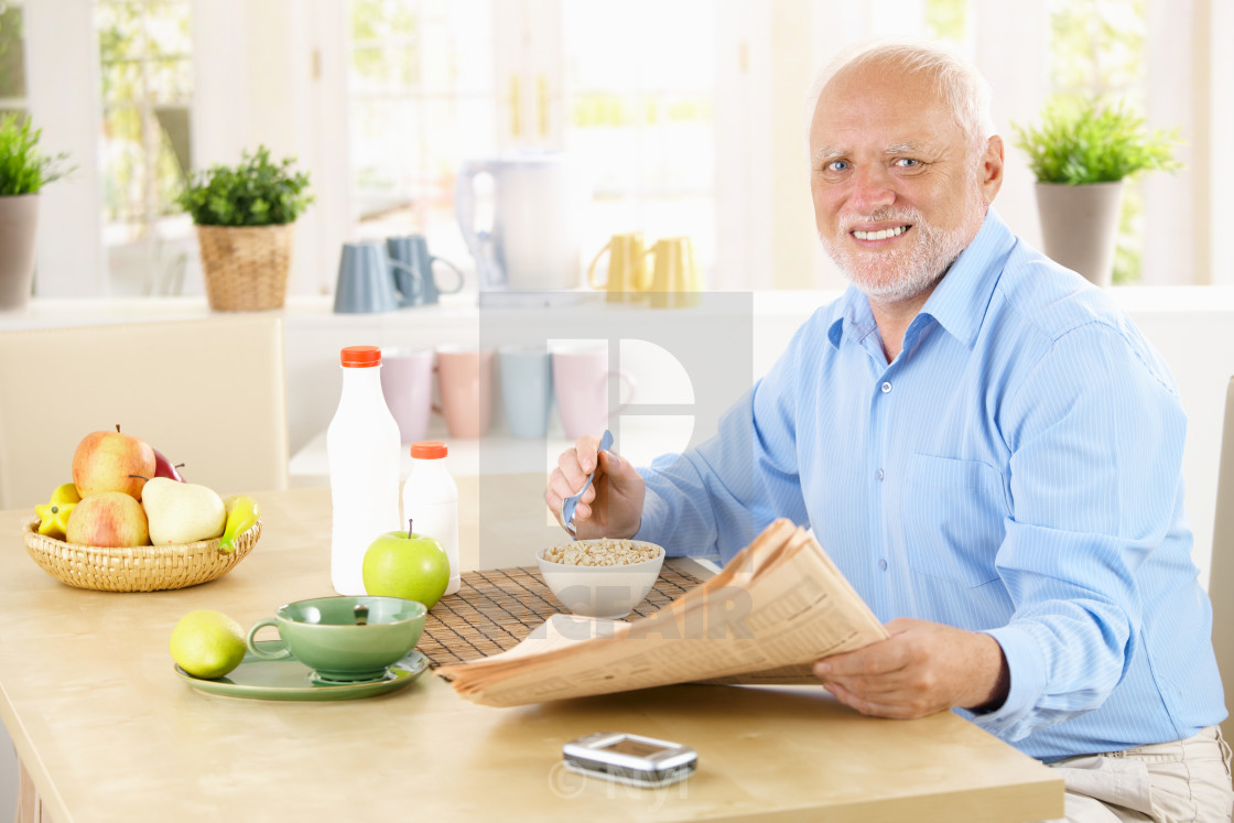 "Portrait of healthy senior at breakfast" stock image