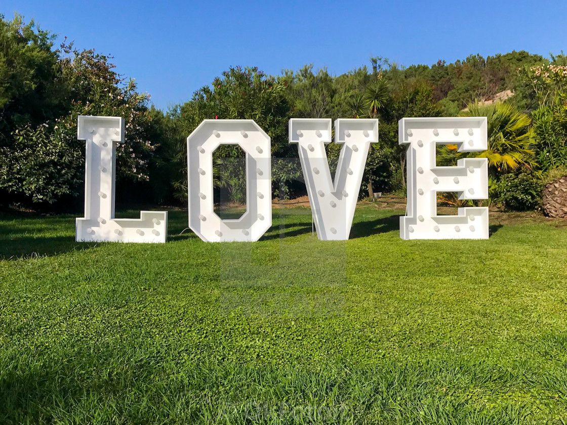 "Love written in green garden" stock image