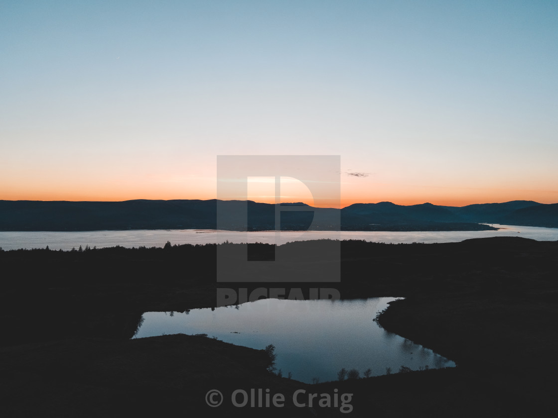 "Sunset over a lake in East Scotland" by Ollie Craig - £24.80 "Sunset over a lake in East Scotland" stock image