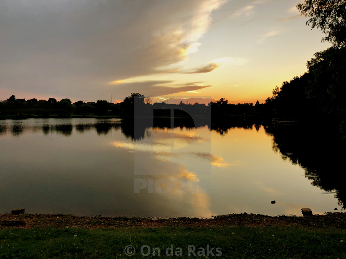 Sunset Reflections In The Lake With Silhouettes Of The Trees License Download Or Print For 19 22 Photos Picfair