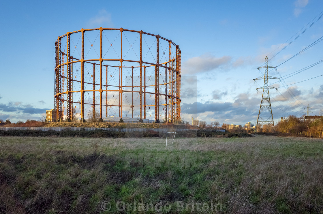 "Gas Holder, Goalpost and Pylon - East Ham." by Orlando Britain - $31.07 "Gas Holder, Goalpost and Pylon - East Ham." stock image