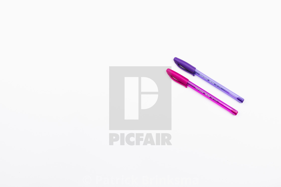 "Pink and Purple Pens on a White Background" stock image