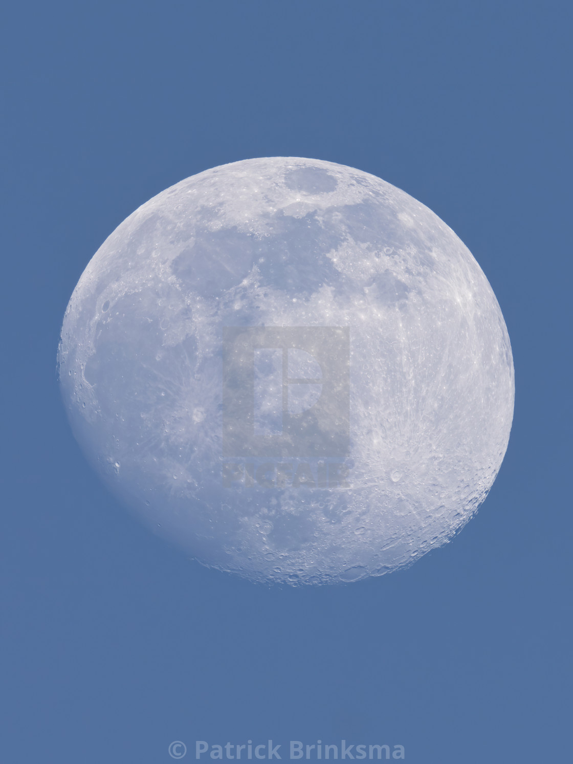 "Moon In A Blue Sky - Portrait" stock image