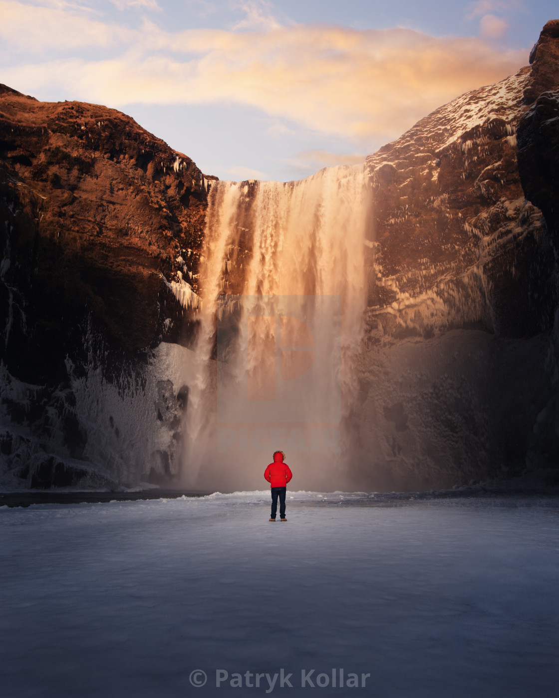 "Person overlooking Skógafoss" by Patryk Kollar - £19.84 "Person overlooking Skógafoss" stock image