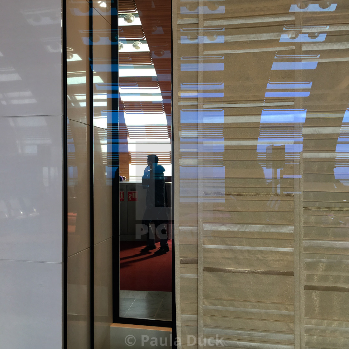 "Passenger reflection, Charles de Gaulle airport" stock image