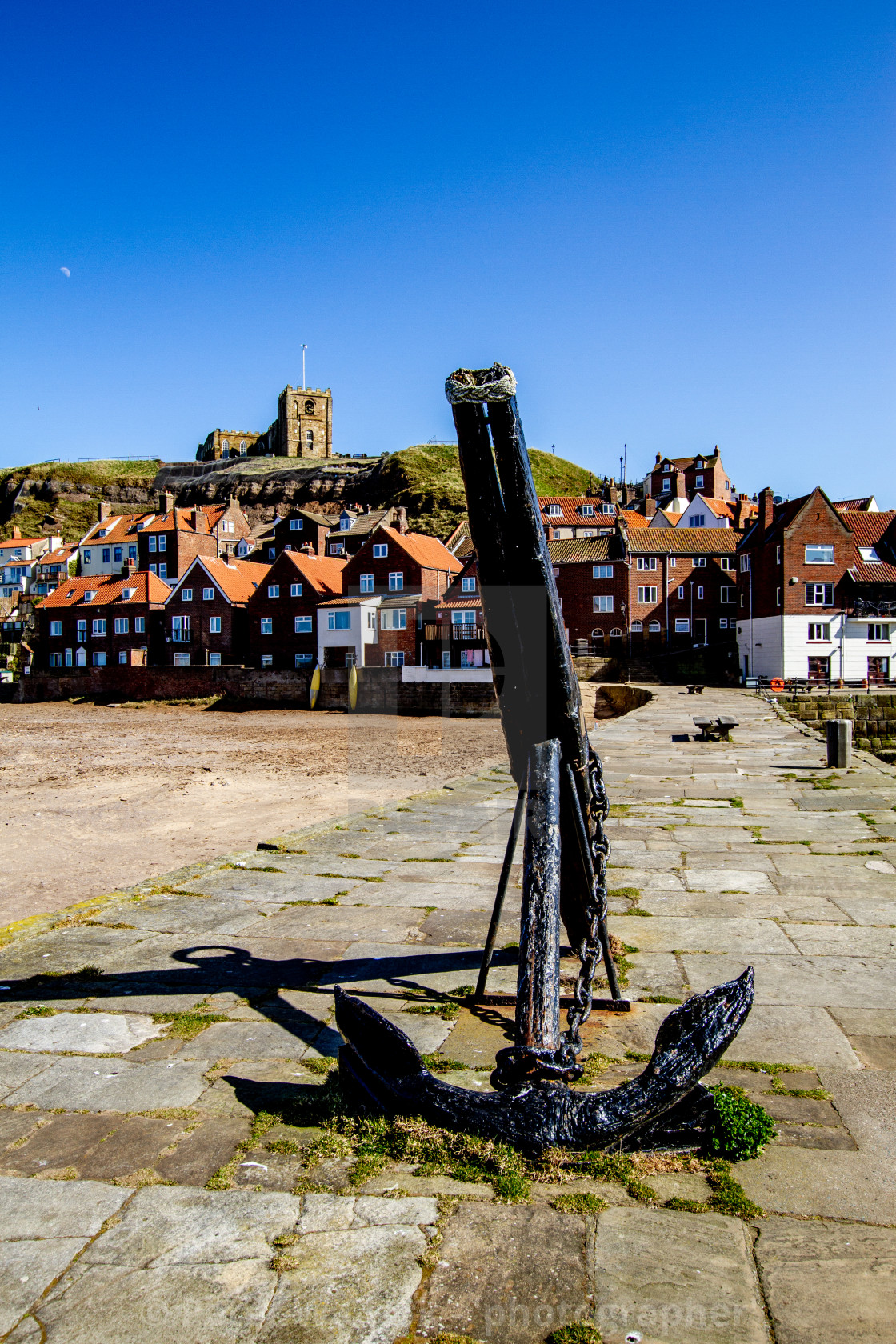 "Whitby,UK,Yorkshire,East coast, Old Anchor on Tate Hill Pier. St Mary's Church in the Background." by Peter W. Clark - 'photographer' - £20.00 "Whitby,UK,Yorkshire,East coast, Old Anchor on Tate Hill Pier. St Mary's Church in the Background." stock image
