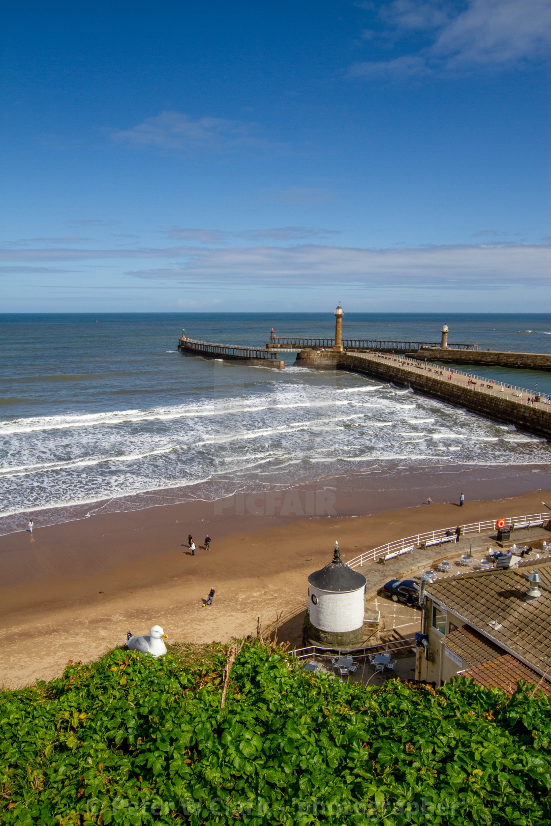 "Whitby,UK,Yorkshire,East coast,View from First Nab over East and West Piers, Harbour Entrance." by Peter W. Clark - 'photographer' - £20.00 "Whitby,UK,Yorkshire,East coast,View from First Nab over East and West Piers, Harbour Entrance." stock image
