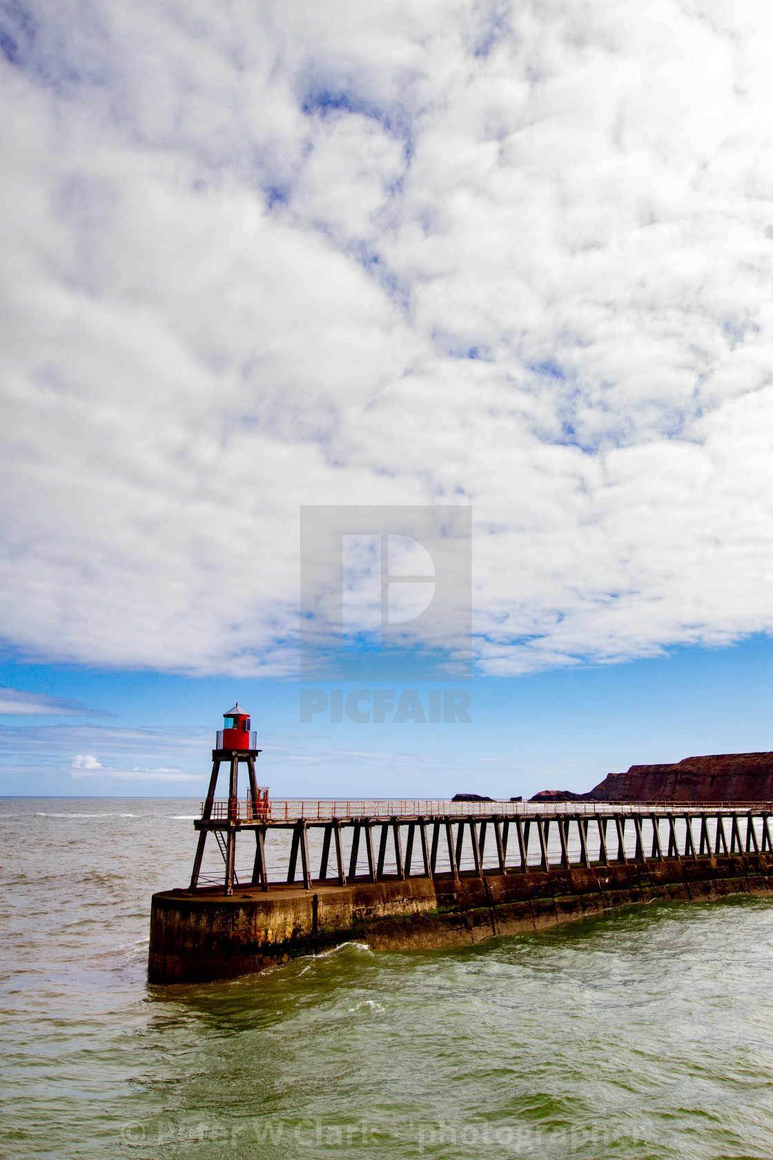 "Whitby,UK,Yorkshire,East coast, East Pier Breakwater and Harbour Light." by Peter W. Clark - 'photographer' - £20.00 "Whitby,UK,Yorkshire,East coast, East Pier Breakwater and Harbour Light." stock image