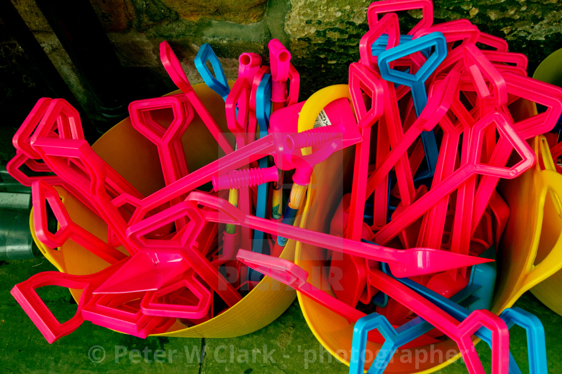 "Beach spades on display outside shop in Robin Hoods Bay, Yorkshire." by Peter W. Clark - 'photographer' - £10.00 "Beach spades on display outside shop in Robin Hoods Bay, Yorkshire." stock image