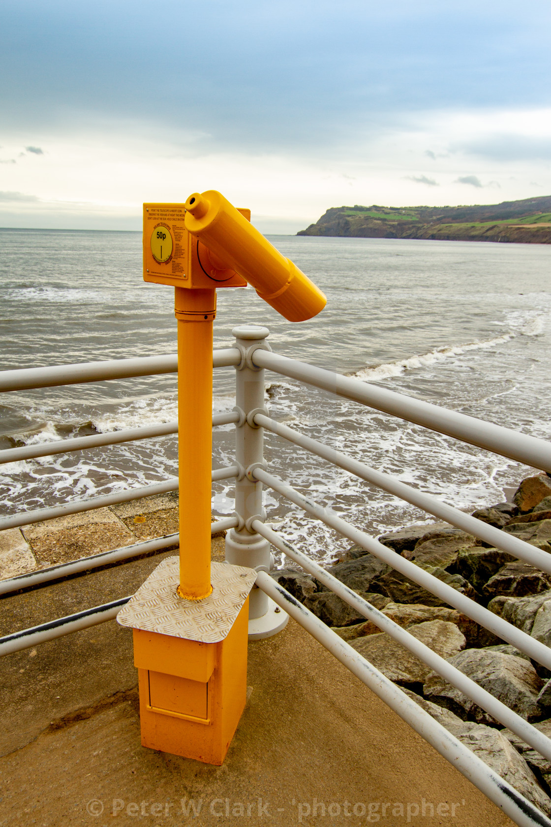 "Robin Hoods Bay, Yellow Coin Operated Telescope on the Quarterdeck" by Peter W. Clark - 'photographer' - £15.00 "Robin Hoods Bay, Yellow Coin Operated Telescope on the Quarterdeck" stock image