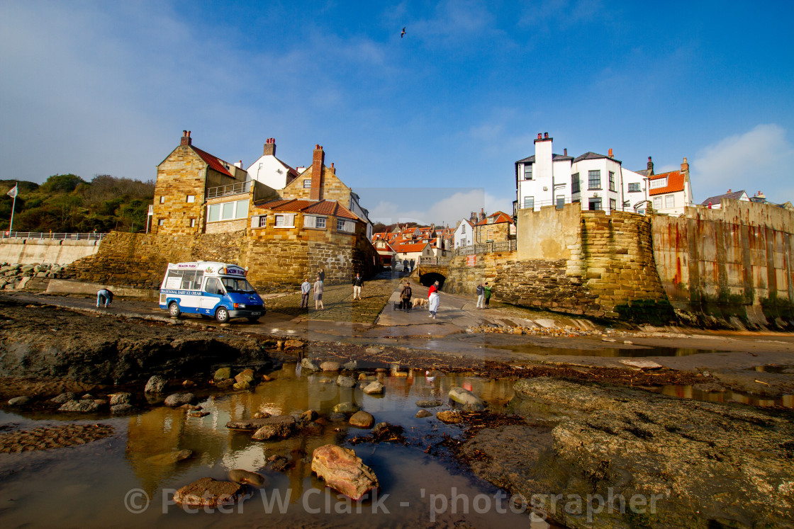 "Robin Hoods Bay, Yorkshire East Coast, England. A Panoramic View from the Beach of the village with Ice Cream Van to the Foreground. Photographed 10th October 2010" by Peter W. Clark - 'photographer' - £20.00 "Robin Hoods Bay, Yorkshire East Coast, England. A Panoramic View from the Beach of the village with Ice Cream Van to the Foreground. Photographed 10th October 2010" stock image