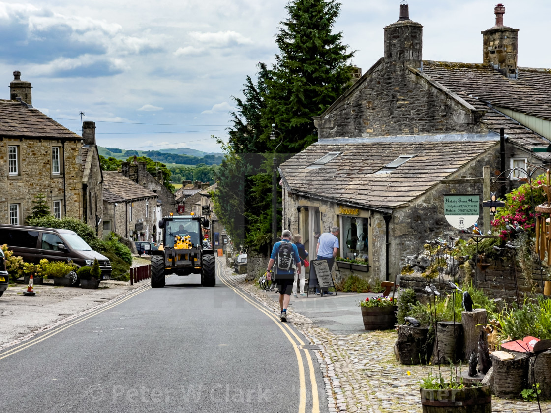 "Grassington, Yorkshire Dales. Tractor on Main Street." by Peter W. Clark - 'photographer' - £10.00 "Grassington, Yorkshire Dales. Tractor on Main Street." stock image