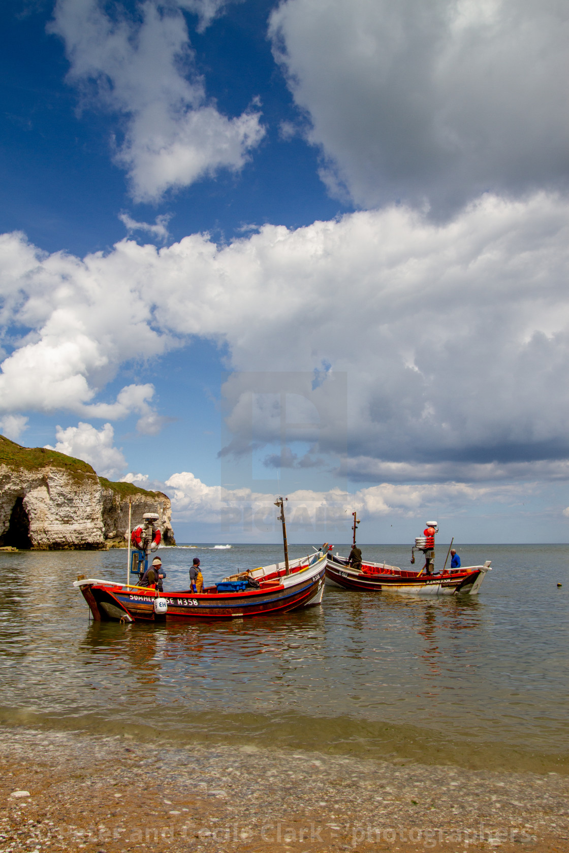 "Fishing Cobbles Unloading their Catch of Crabs at North Landing." stock image