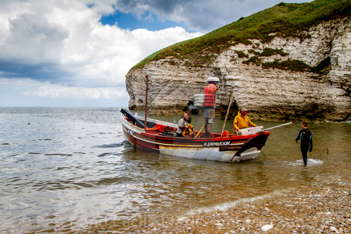 "Fishing Cobbles Unloading their Catch of Crabs at North Landing." stock image