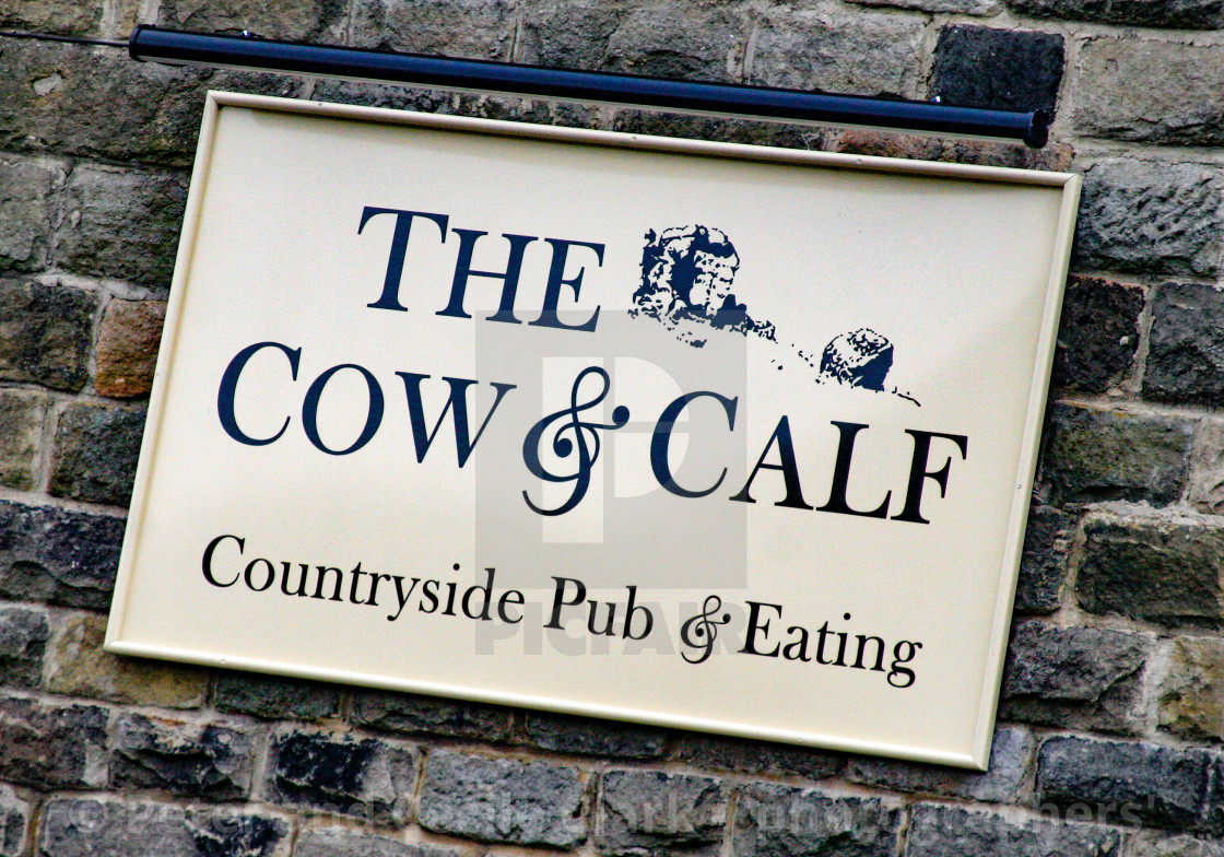 "The Cow and Calf, Ilkley, Country Pub and Eating. Wall sign" by Peter and Cecile Clark - 'photographers' - $25.27 "The Cow and Calf, Ilkley, Country Pub and Eating. Wall sign" stock image