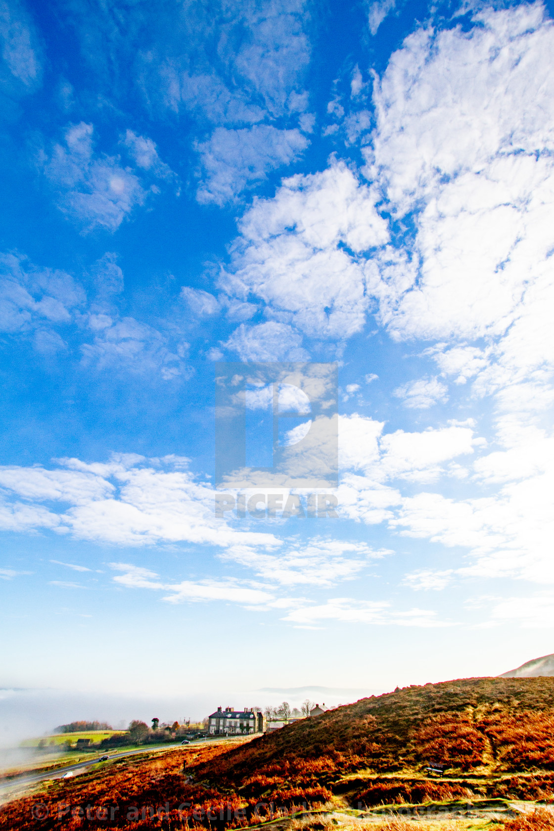 "Ilkley Moor in Early Morning Mist, Cow and Calf Hotel in the Background." stock image