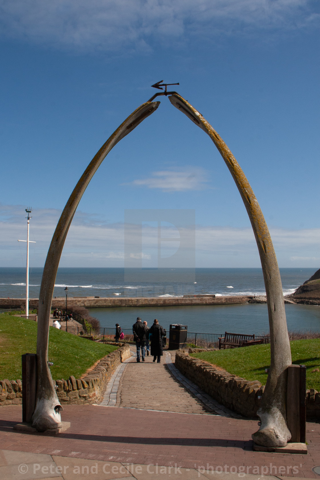 "Whitby,UK,Yorkshire,East coast, Monument, the Whalebone Arch. With pier and sea in the background." stock image