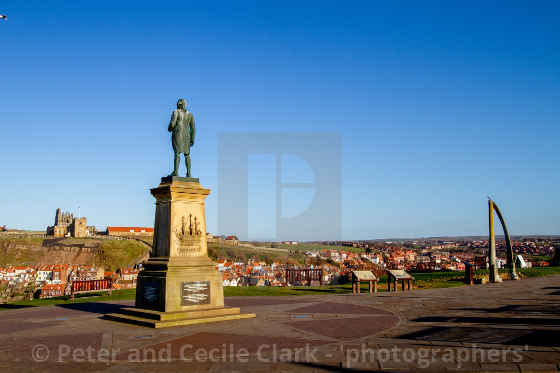 "Whitby,UK,Yorkshire,East coast, Monuments, Captain Cook Statue and the Whalebone Arch. Whitby Abbey in the Background" stock image