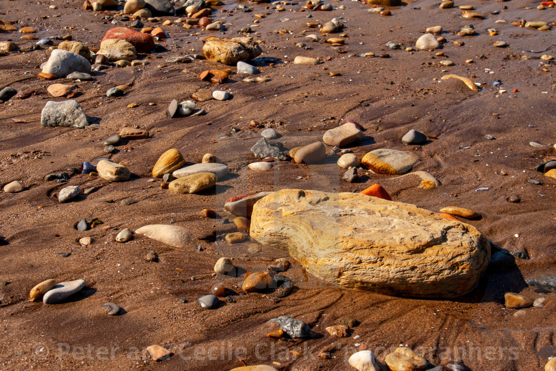 "Whitby, UK, Yorkshire East Coast, Pebble Assortment and Small Rock on the Beach" stock image