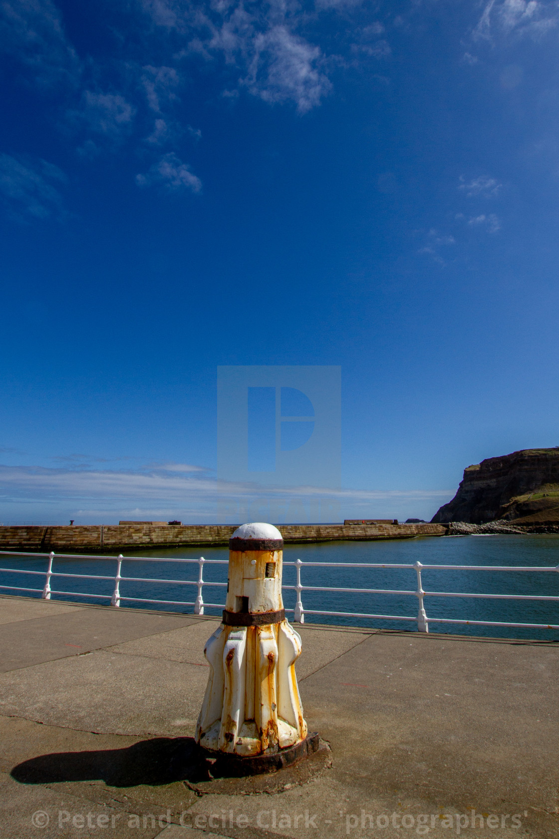 "Whitby,UK,Yorkshire,East coast, White Capstan on the Harbour Wall" stock image