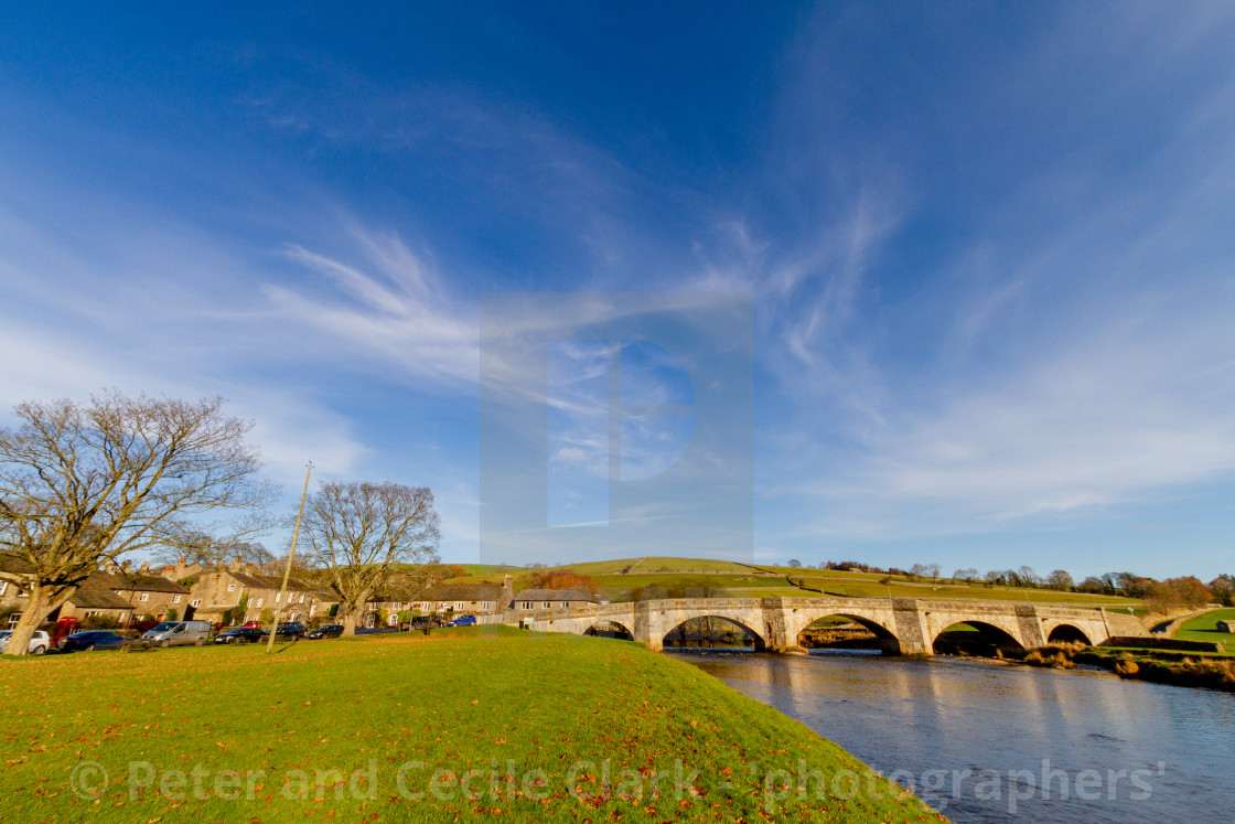 "Burnsall, Yorkshire Dales Village, England, Arched Stone Bridge over the River Wharfe" stock image