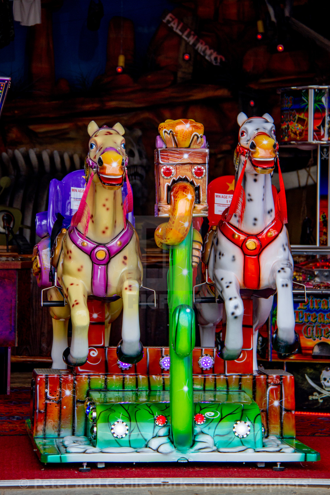 "Colourful Coin Operated Horse Ride in Whitby Amusement Arcade on Yorkshire East Coast." stock image