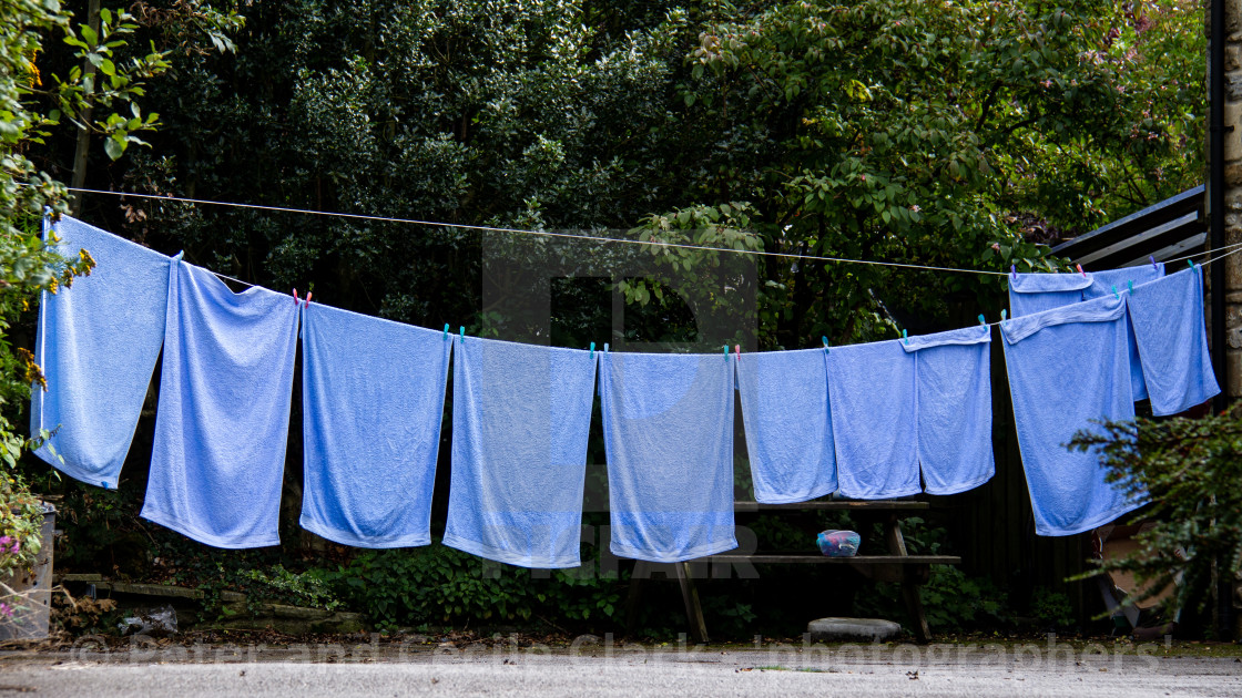 "Blue Towels Hanging out to Dry on Washing Line in Kettlewell a Yorkshire Dales Village." stock image