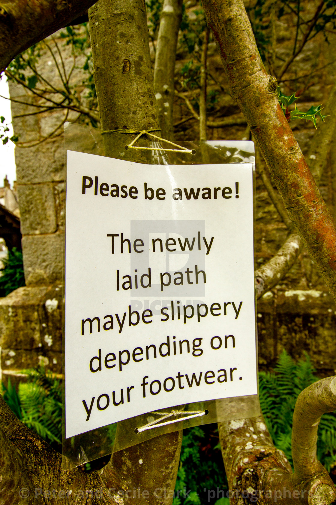 "Warning Sign, Slippy Path, St Mary's Church, Kettlewell, Yorkshire Dales." stock image