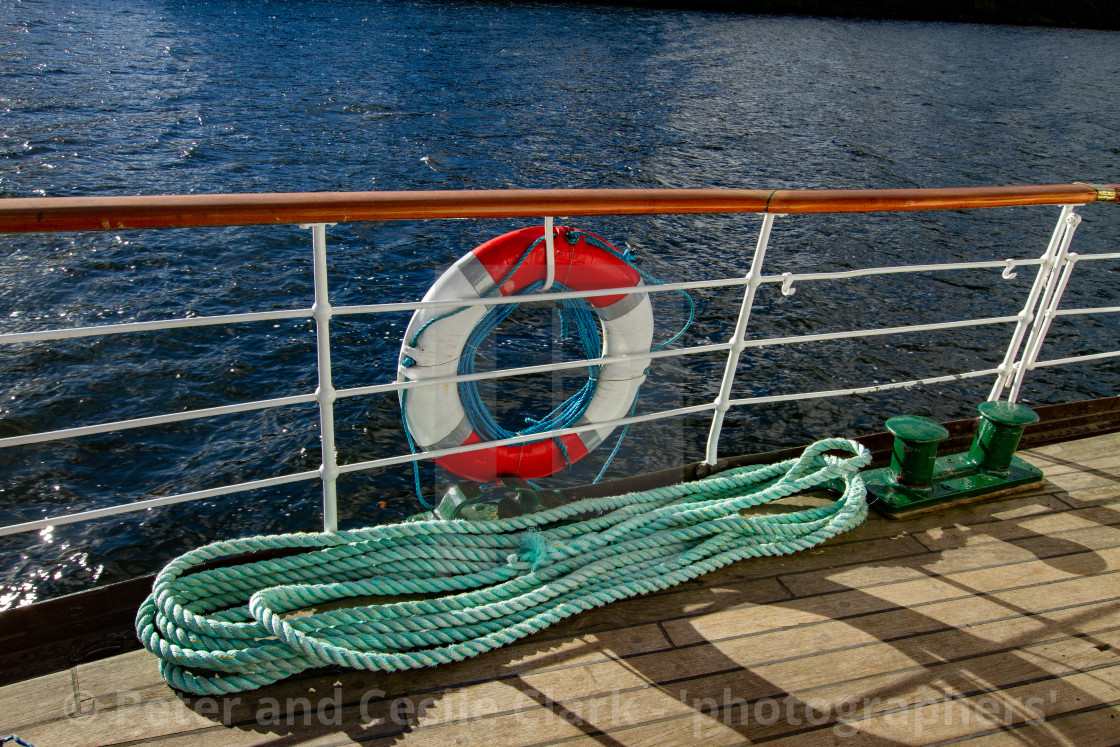 "Lifebuoy and Rope on MS Teal, Windermere." by Peter and Cecile Clark - 'photographers' - $12.70 "Lifebuoy and Rope on MS Teal, Windermere." stock image