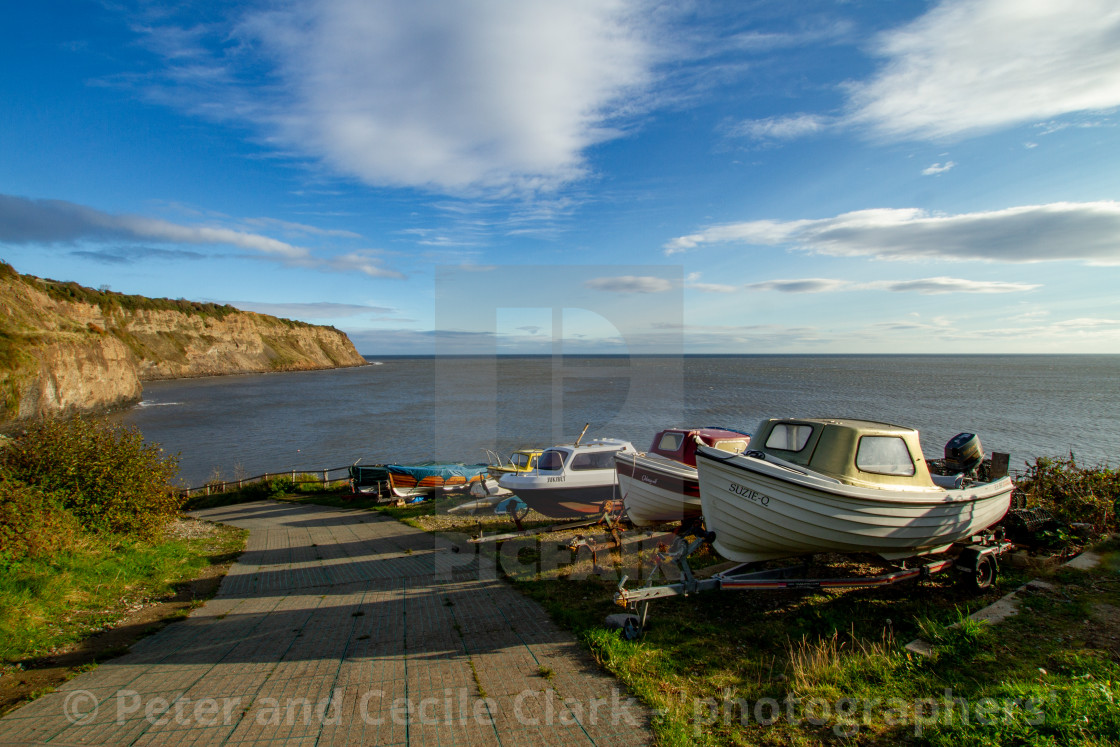 "Small Fishing Boats on Trailers Parked Overlooking Robin Hoods Bay, Yorkshire." stock image